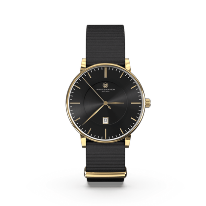 Montre Diamantina Whitehaven avec cadran noir, boîtier finition or jaune et bracelet NATO noir – vue de face